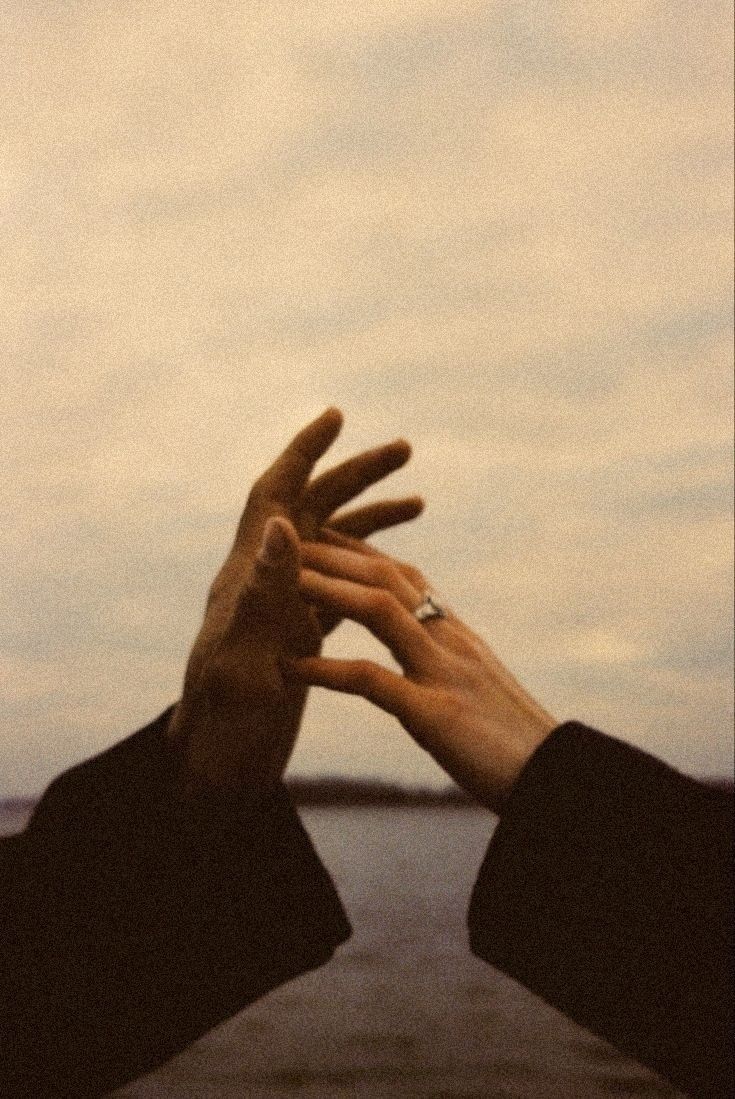 Couple's hands with wedding rings
